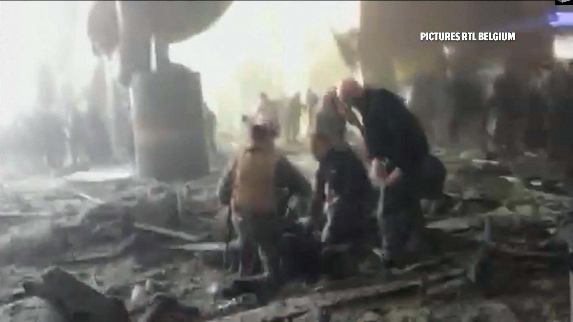 In this still image taken from video from RTL Belgium people receive treatment in the debris strewn terminal at Brussels Airport, in Brussels after explosions Tuesday, March 22, 2016. Authorities locked down the Belgian capital on Tuesday after explosions rocked the Brussels airport and subway system, killing a number of people and injuring many more. Belgium raised its terror alert to its highest level, diverting arriving planes and trains and ordering people to stay where they were. Airports across Europe tightened security. (RTL via AP) BELGIUM OUT TV OUT NO ARCHIVE In this still image taken from video from RTL Belgium people receive treatment in the debris strewn terminal at Brussels Airport, in Brussels after explosions Tuesday, March 22, 2016. Authorities locked down the Belgian capital on Tuesday after explosions rocked the Brussels airport and subway system, killing a number of people and injuring many more. Belgium raised its terror alert to its highest level, diverting arriving planes and trains and ordering people to stay where they were. Airports across Europe tightened security. (RTL via AP) BELGIUM OUT TV OUT NO ARCHIVE