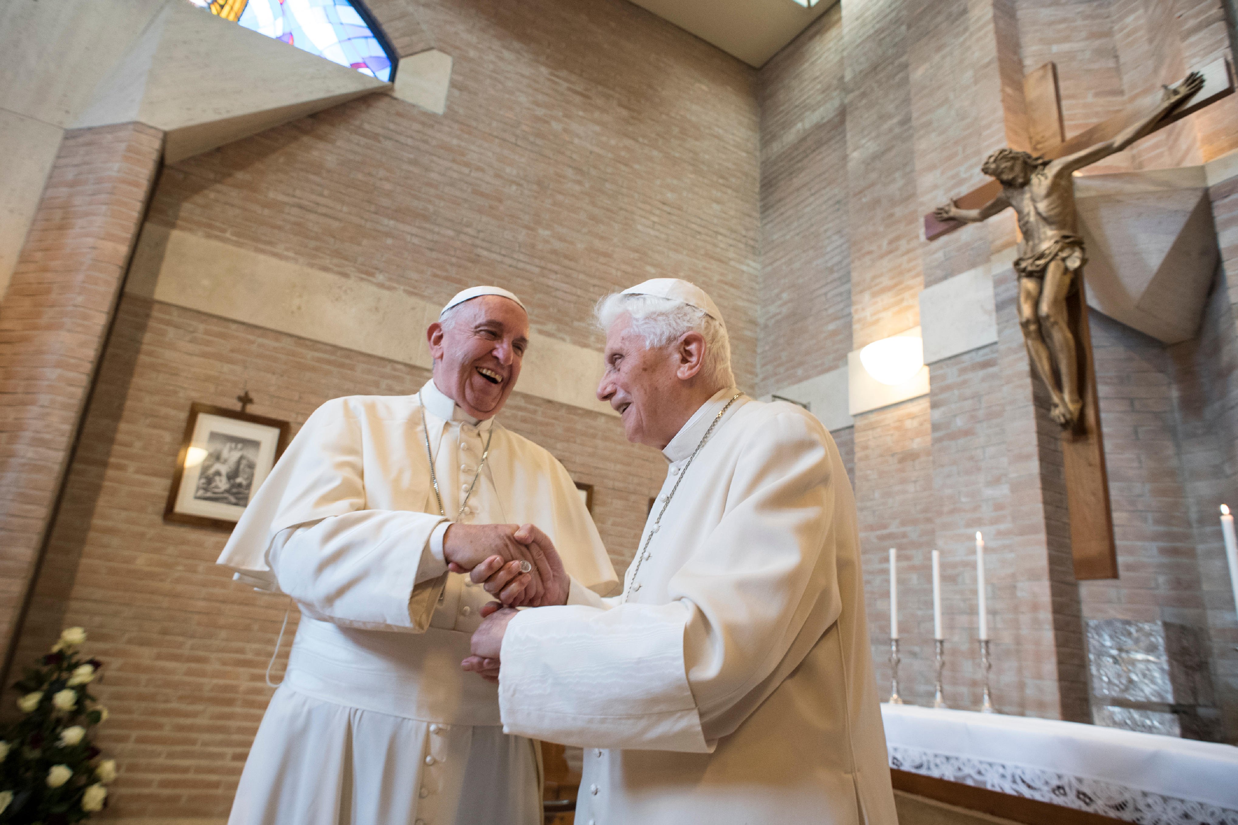 TOPSHOT - This handout picture released by the Vatican press office shows Pope Francis (L) and Pope emeritus Benedict XVI during a meeting with newly nominated cardinals after a consistory on November 19, 2016 at the Vatican. Pope Francis created 17 new cardinals from across the globe Saturday, elevating them in a time-honoured ceremony to an elite body that advises and elects popes. Three of them are from the US, while others come from corners of the world where the Catholic Church needs a boost. / AFP PHOTO / OSSERVATORE ROMANO AND AFP PHOTO / HO / RESTRICTED TO EDITORIAL USE - MANDATORY CREDIT  TOPSHOT - This handout picture released by the Vatican press office shows Pope Francis (L) and Pope emeritus Benedict XVI during a meeting with newly nominated cardinals after a consistory on November 19, 2016 at the Vatican. Pope Francis created 17 new cardinals from across the globe Saturday, elevating them in a time-honoured ceremony to an elite body that advises and elects popes. Three of them are from the US, while others come from corners of the world where the Catholic Church needs a boost. / AFP PHOTO / OSSERVATORE ROMANO AND AFP PHOTO / HO / RESTRICTED TO EDITORIAL USE - MANDATORY CREDIT