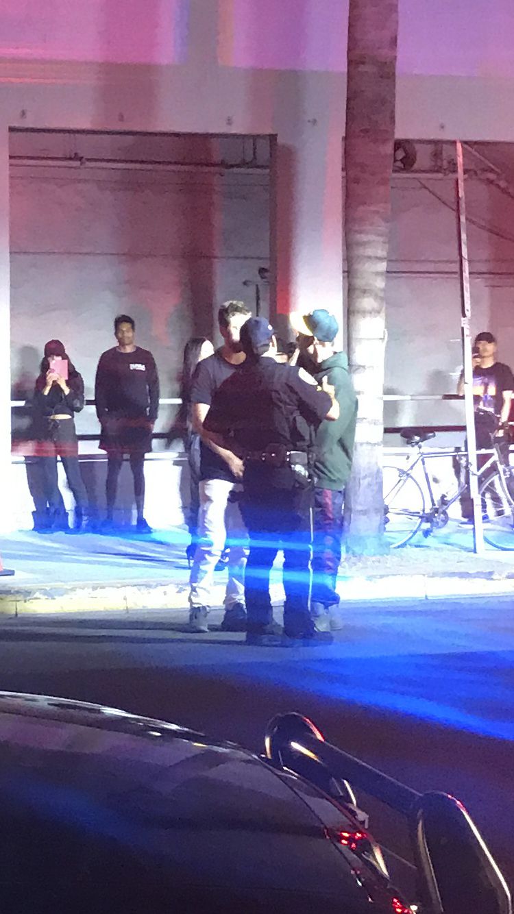 Popstar Justin Bieber, right speaks with two people after an incident in Los Angeles Wednesday July 26, 2016. Police say Justin Bieber accidentally struck a photographer with his pickup truck in Beverly Hills. The Los Angeles Times reported that police Sgt. Matthew Stout said the 57-year-old photographer was hospitalized Wednesday night with injuries that were not life-threatening. The newspaper said Bieber Popstar Justin Bieber, right speaks with two people after an incident in Los Angeles Wednesday July 26, 2016. Police say Justin Bieber accidentally struck a photographer with his pickup truck in Beverly Hills. The Los Angeles Times reported that police Sgt. Matthew Stout said the 57-year-old photographer was hospitalized Wednesday night with injuries that were not life-threatening. The newspaper said Bieber