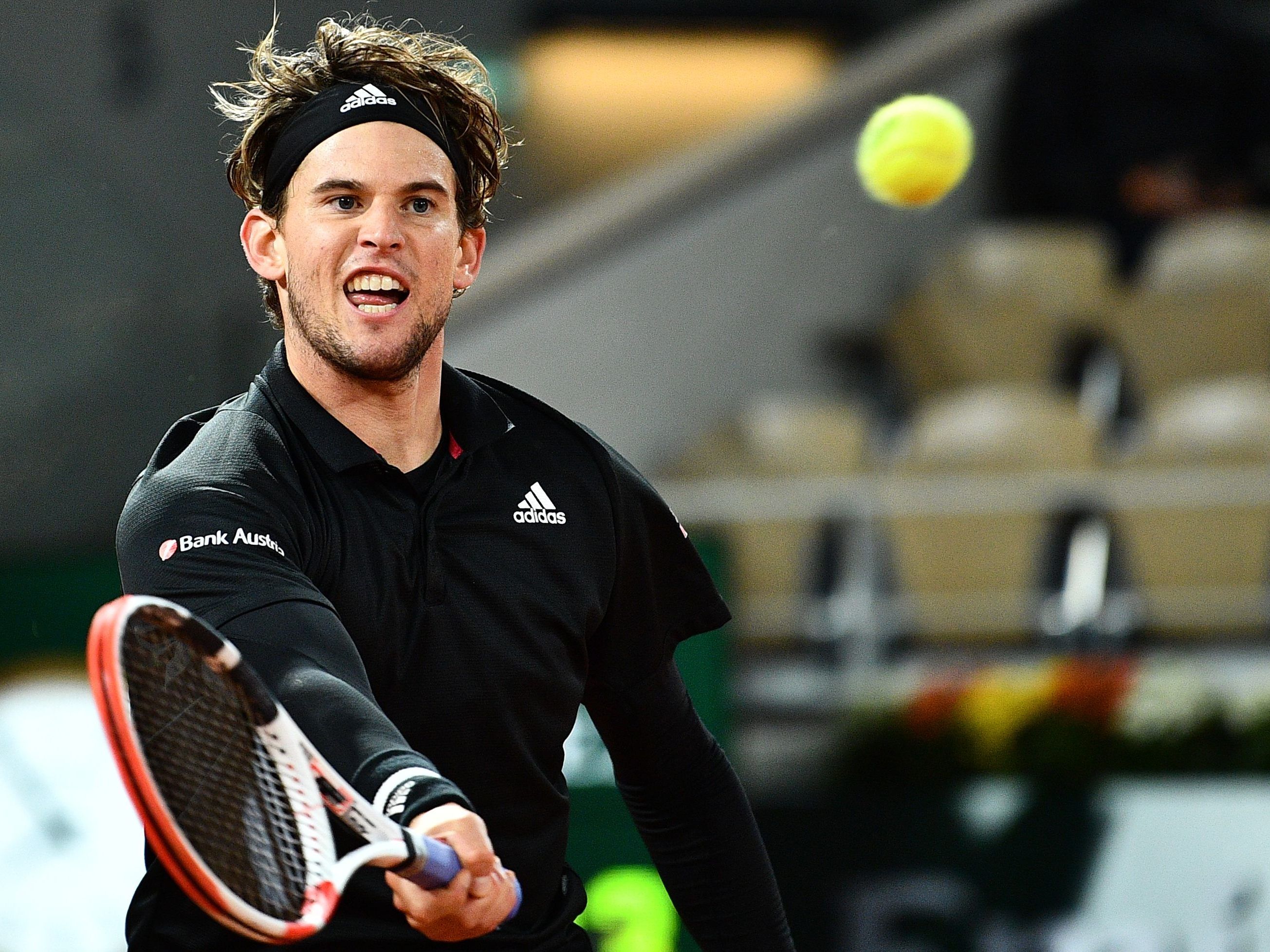 Dominic Thiem returns the ball to Argentina's Diego Schwartzman during their men's singles quarter-final tennis match.