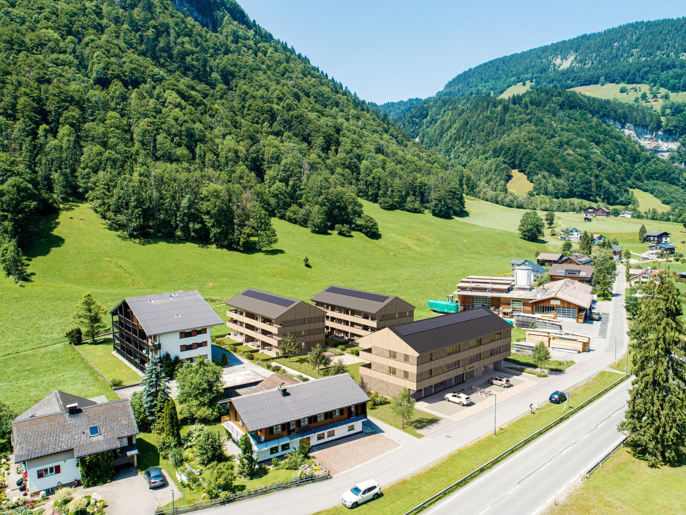 Der Bregenzerwälder Passivhaus-Spezialist Morscher Bauprojekte realisiert im Mellauer Ortsteil In der Mellen 23 Wohnungen, ein Sportgeschäft und seinen neuen Firmensitz in drei Gebäuden.